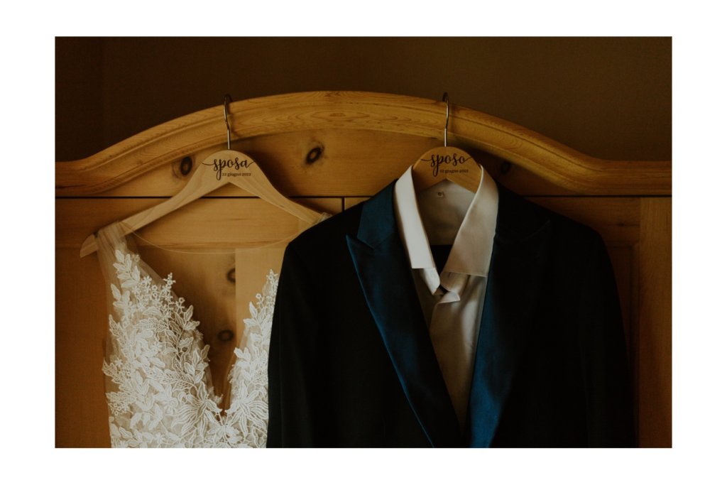 hanging suit and wedding dress
