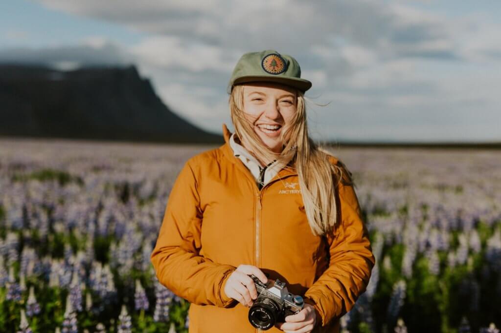 photographer in front of lupines