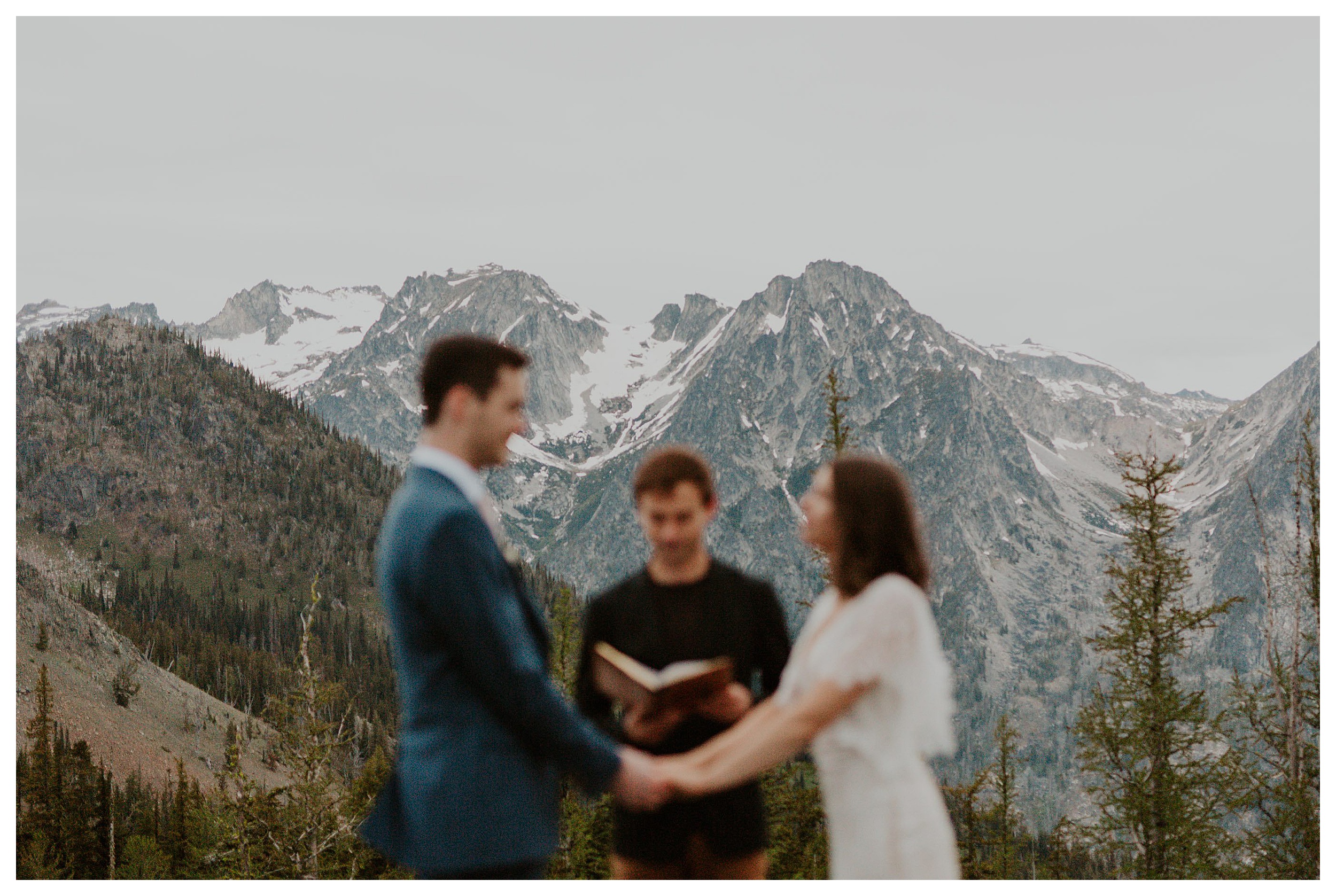 bride and groom holding hands mountain landscape