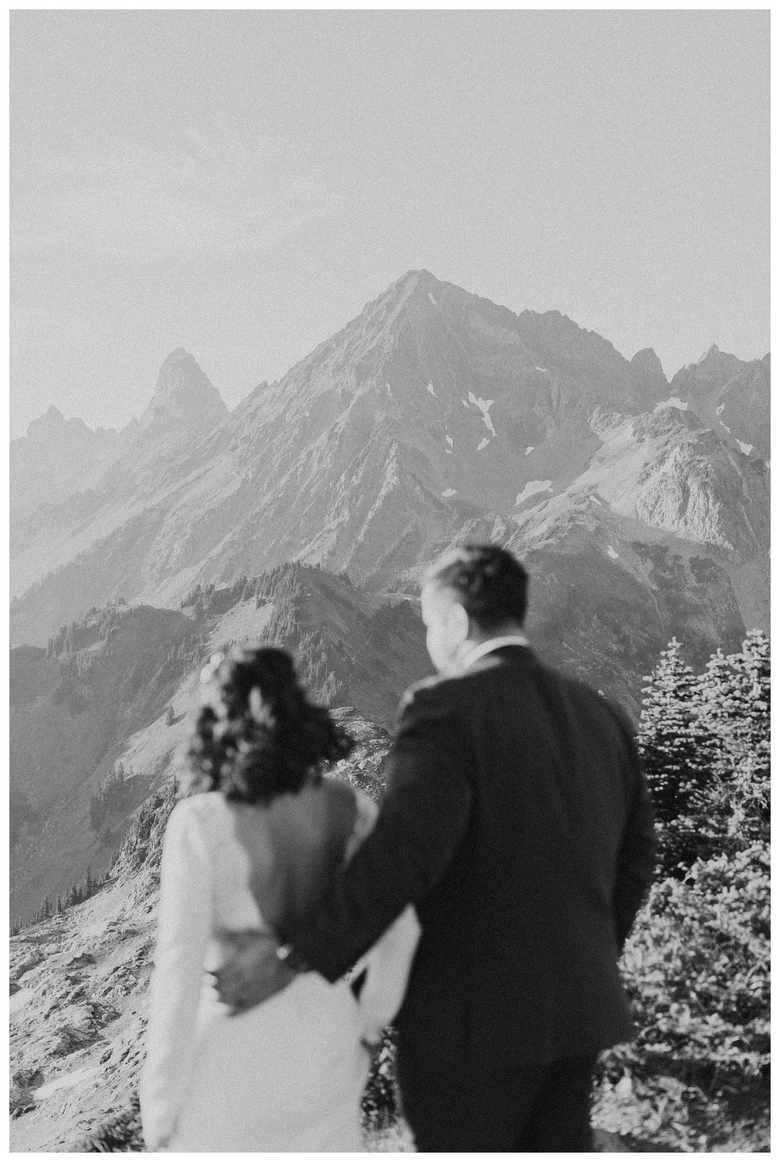 bride and groom standing together mountain landscape
