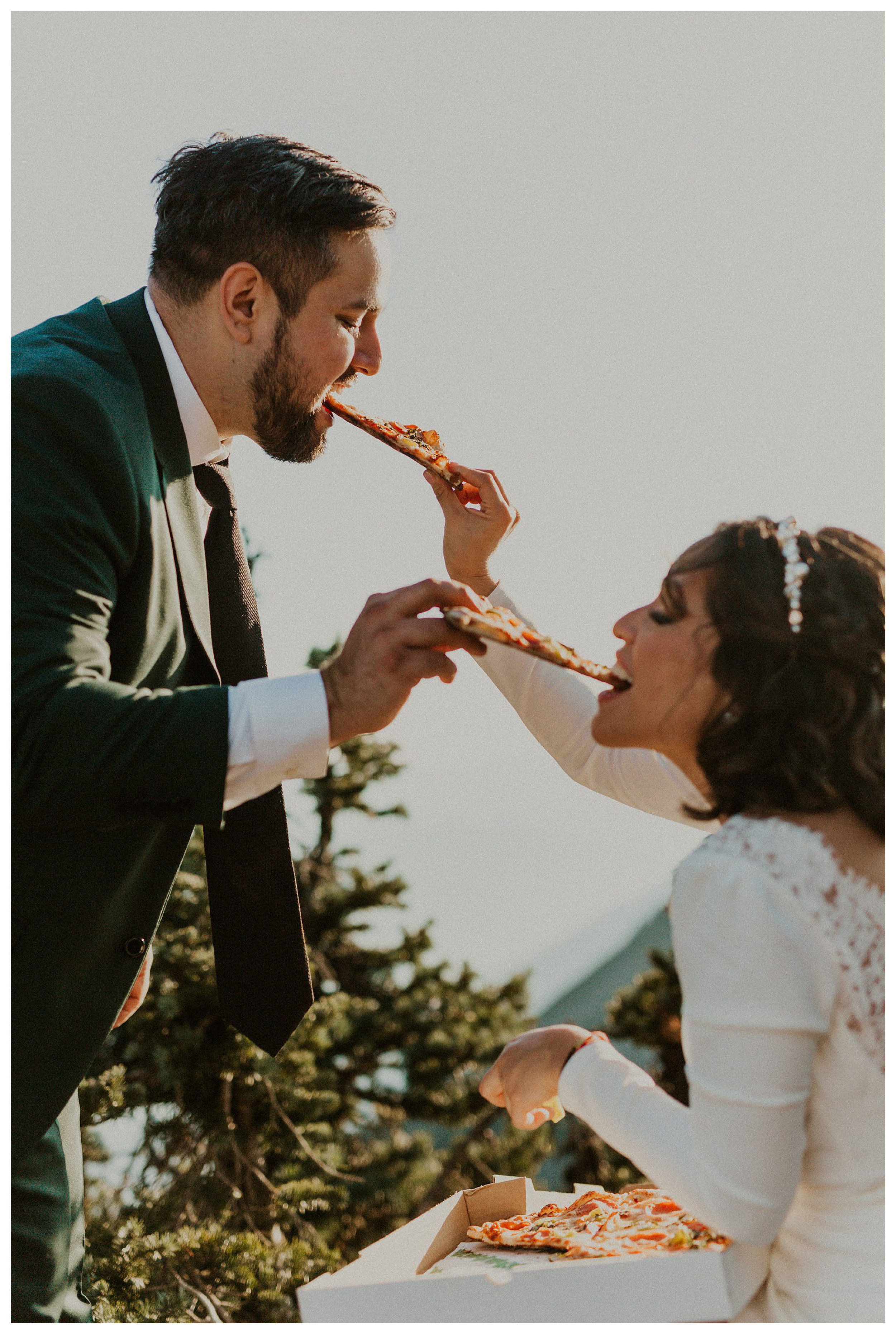 bride and groom eating food