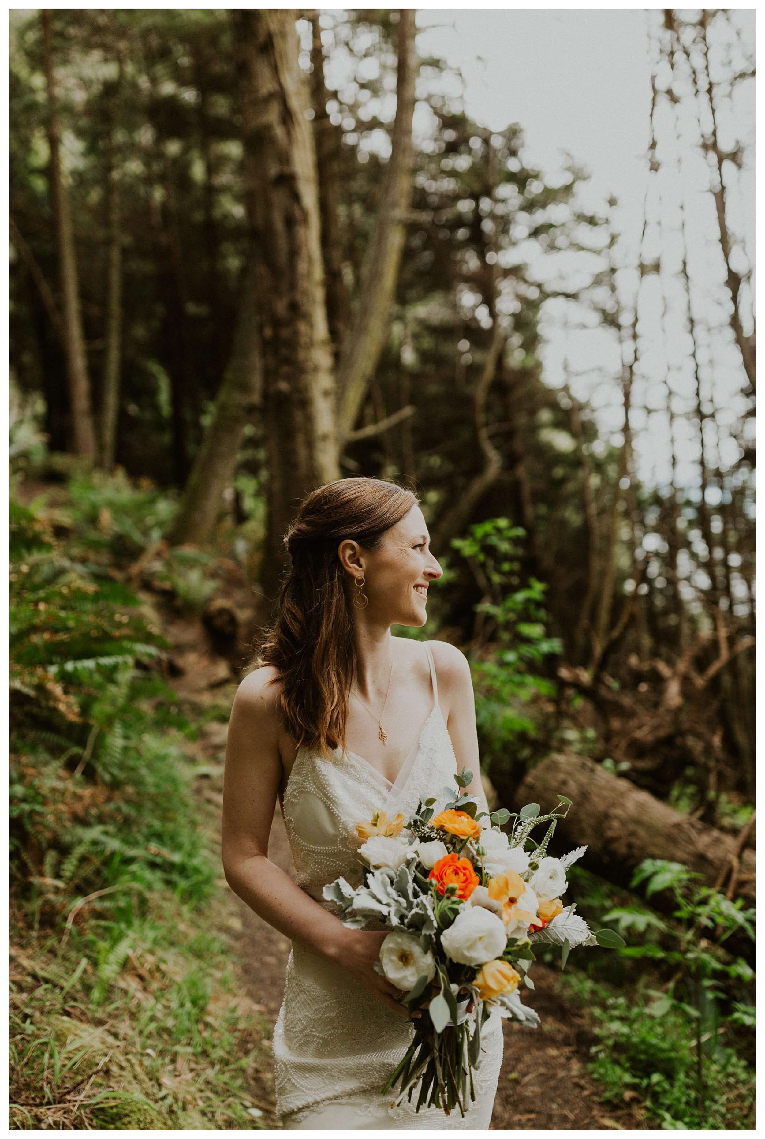 bride smiling with flowers