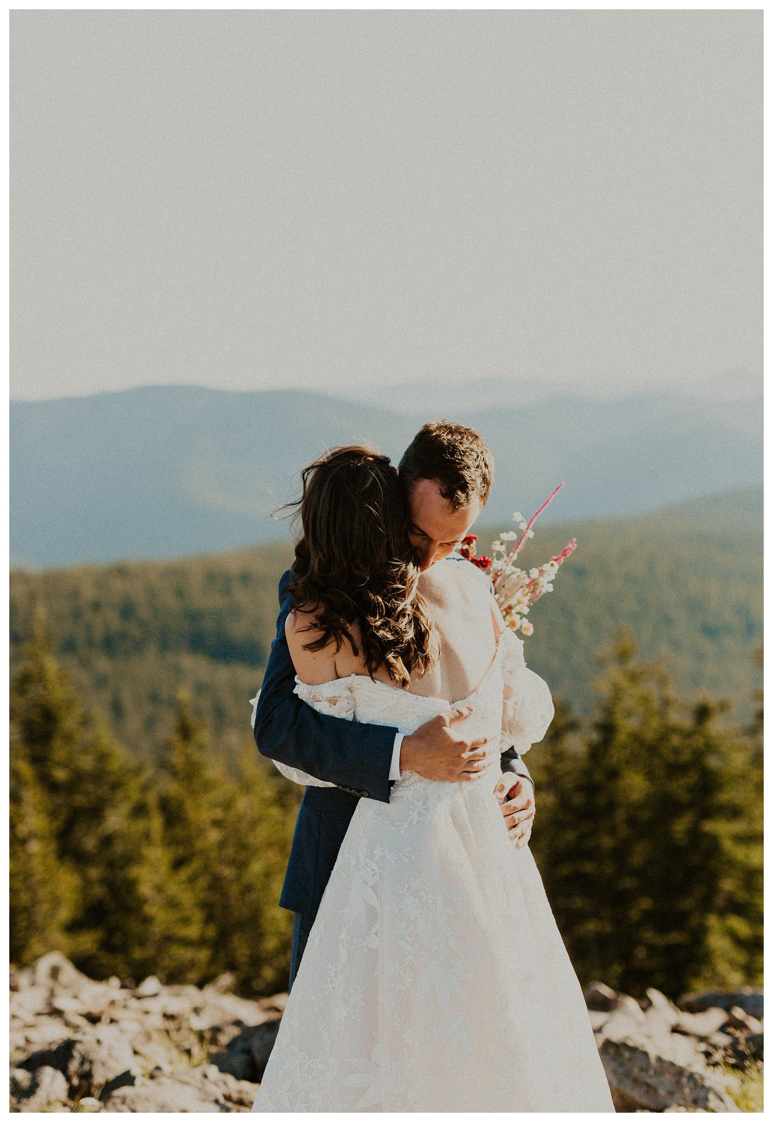 bride and groom hugging mount hood landscape

