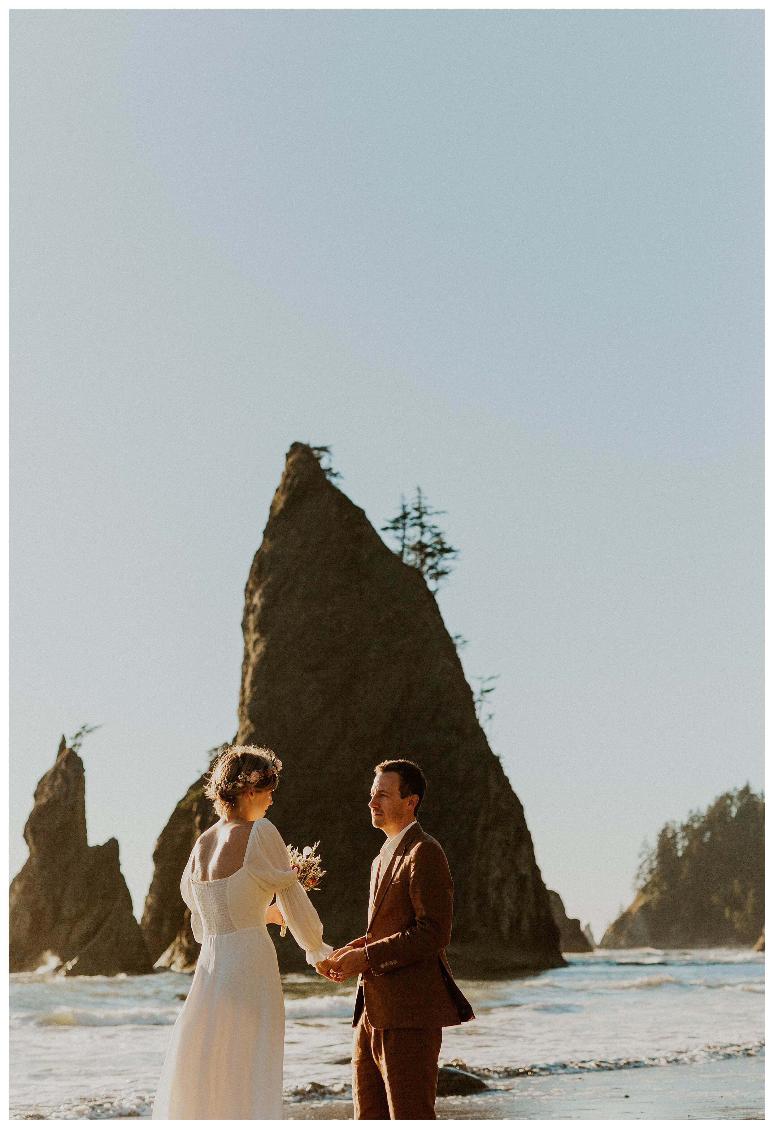 bride and groom holding hands rialto beach
 
