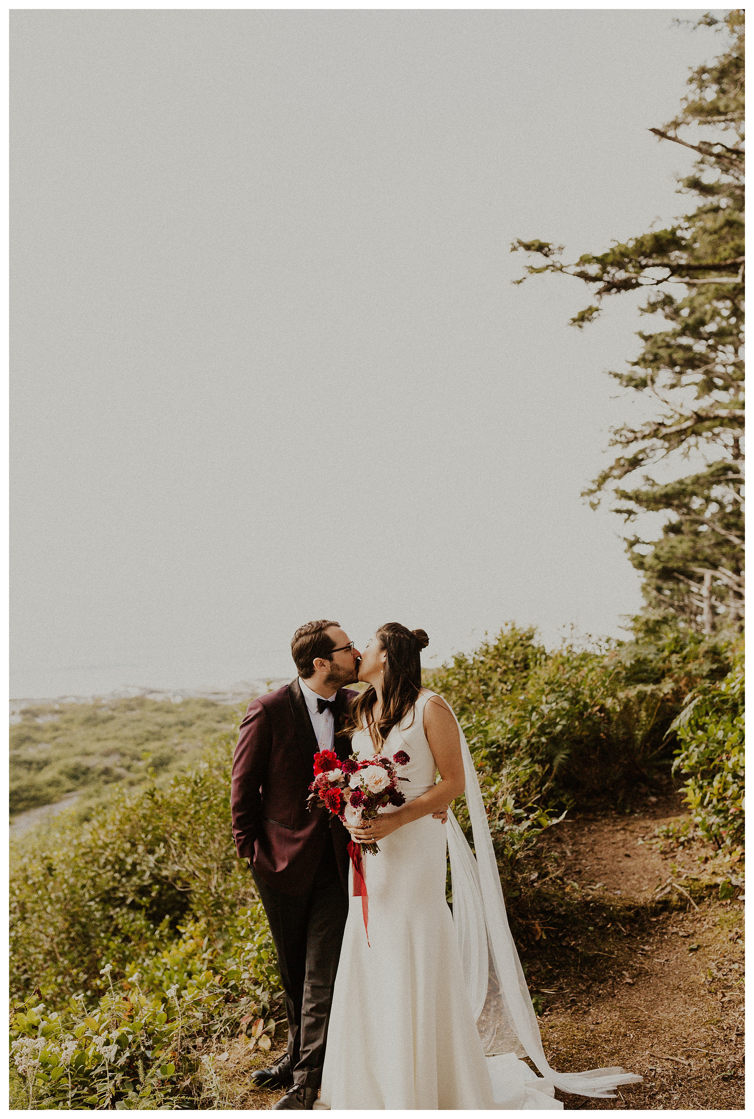 bride and groom kissing olympic national park forest landscape

