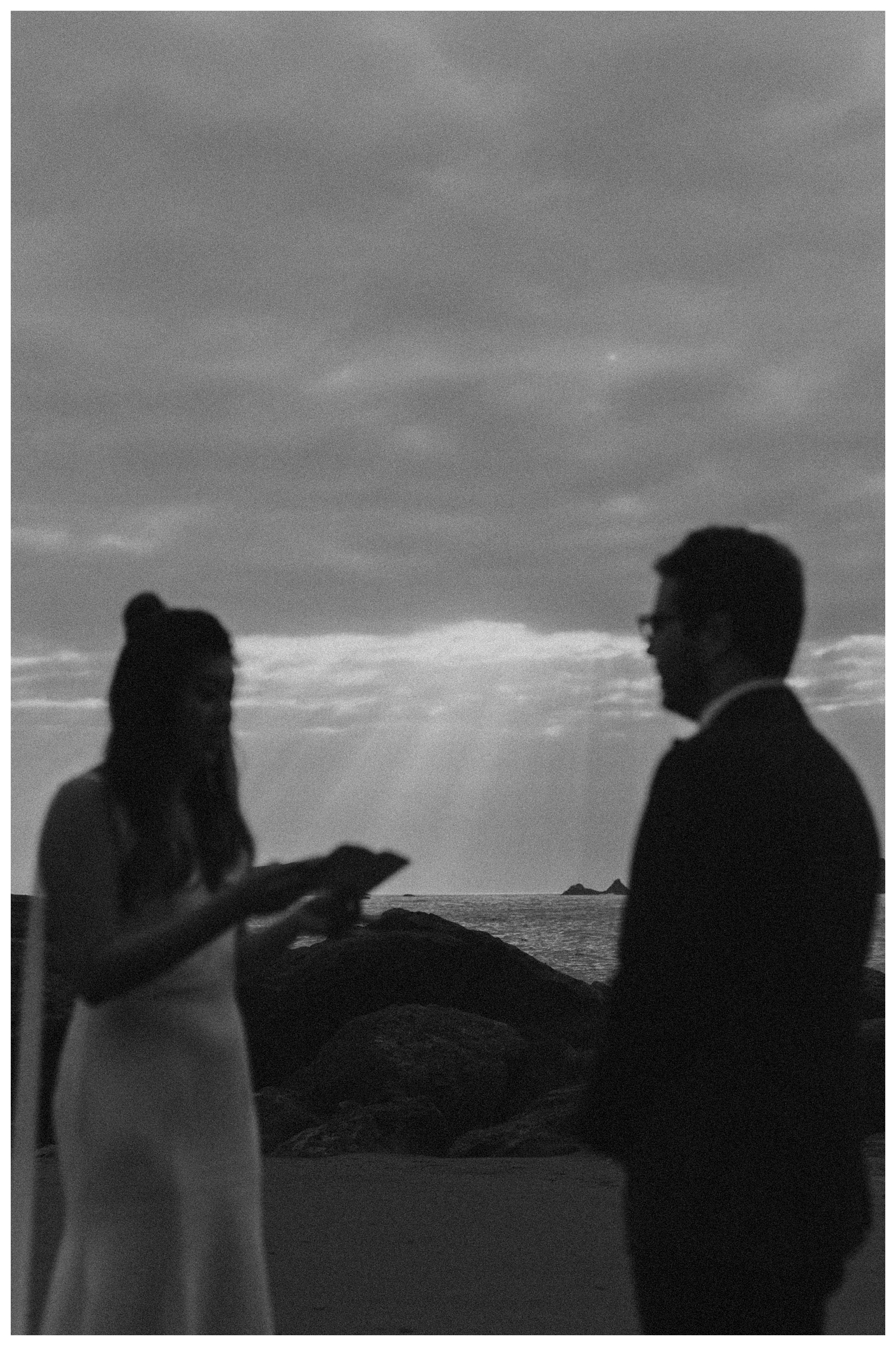 bride and groom reading vows olympic national park coastal landscape