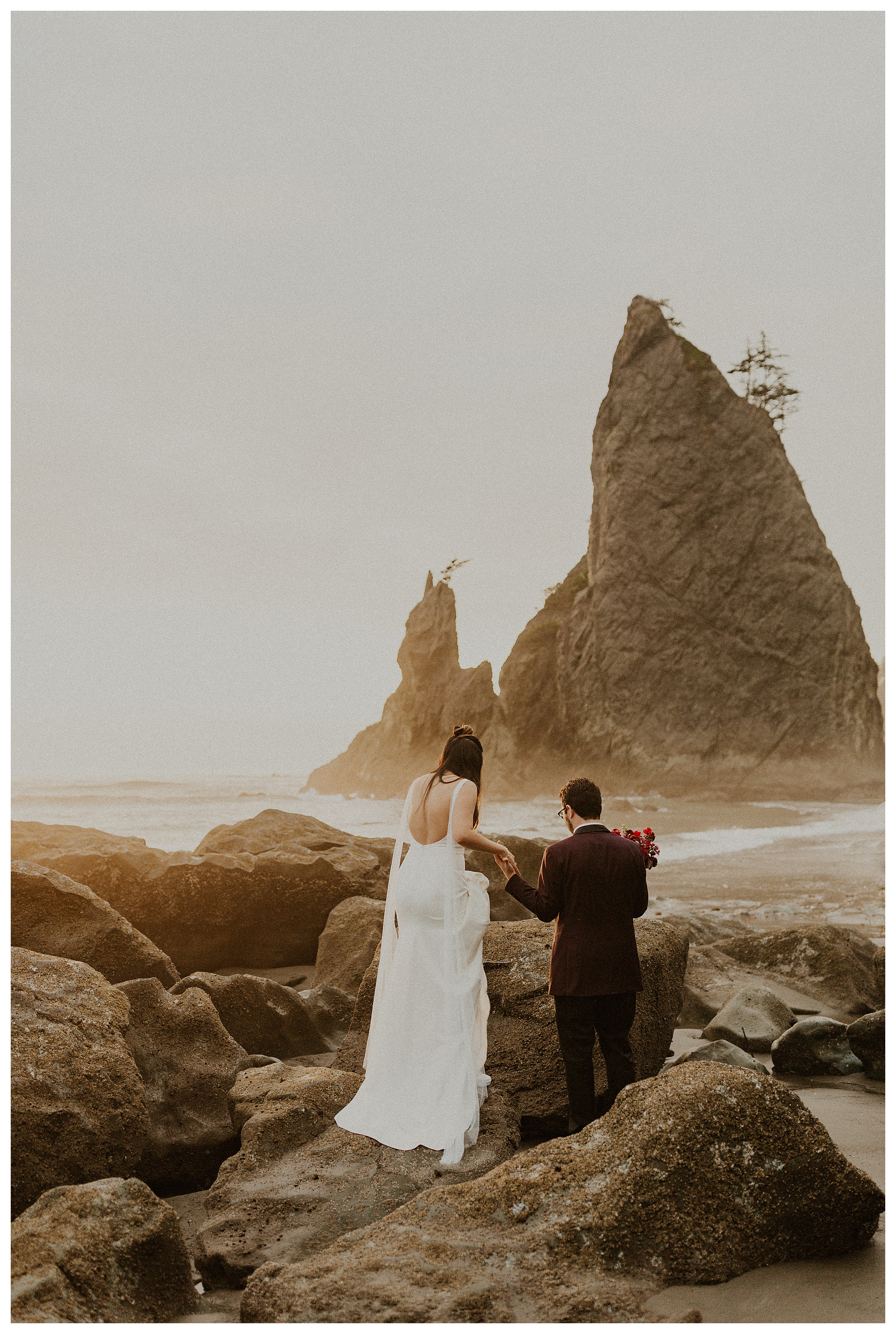 bride and groom walking together olympic national park coastal landscape