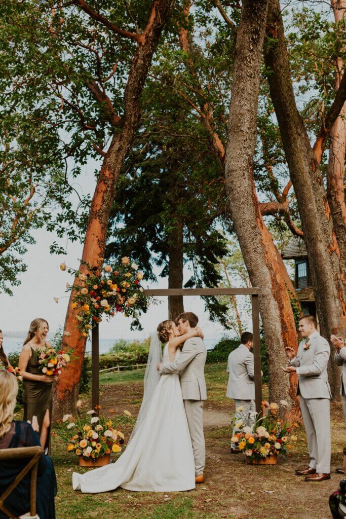 summer wedding ceremony at the captain whidbey inn floral arch